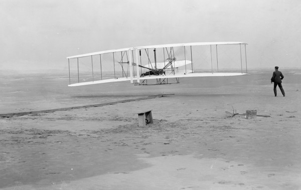 The first successful powered flight by the Wright brothers, 1903.