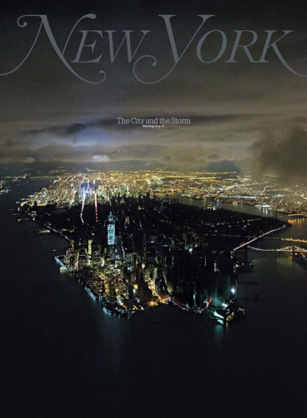 This image provided by New York Magazine shows the magazine's cover released Saturday, Nov. 3, 2012. The cover features a photograph taken by Iwan Baan on Wednesday, Oct, 31, 2012, showing New York City's Manhattan borough, half aglow and half in dark, after Superstorm Sandy slammed into the East Coast and morphed into a huge and problematic system, causing power outages for about 8.5 million. The cost of the storm could exceed  billion in New York alone. (AP Photo/New York Magazine, Iwan Baan)